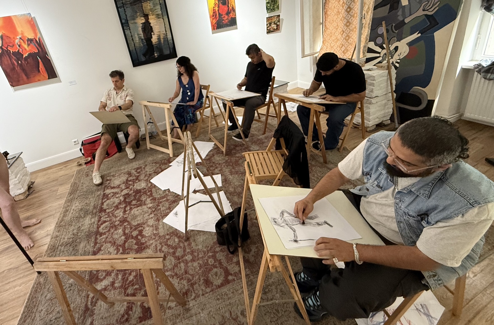 A wide view of participants drawing together in the InSketch studio