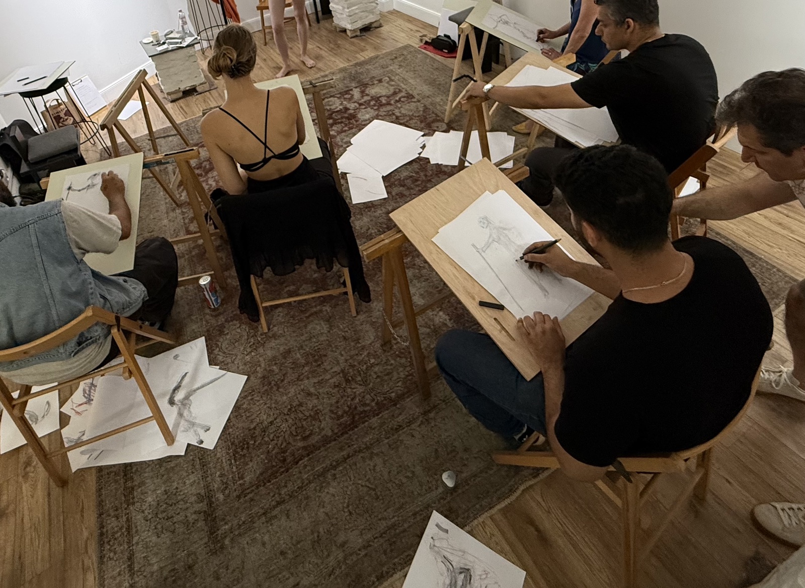 An overhead view of participants drawing during an InSketch session